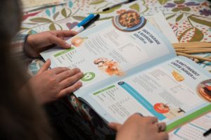 Young people read a cookbook